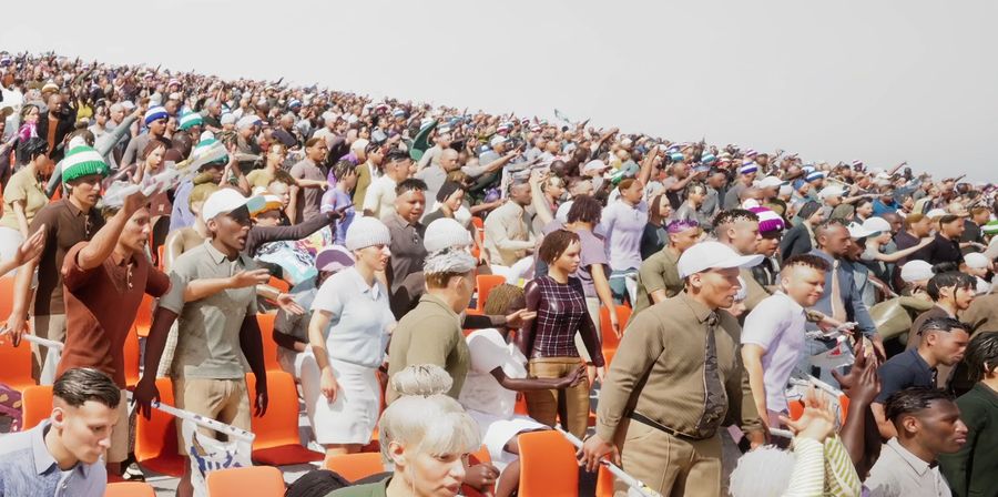 A crowd stretching up a stadium stand